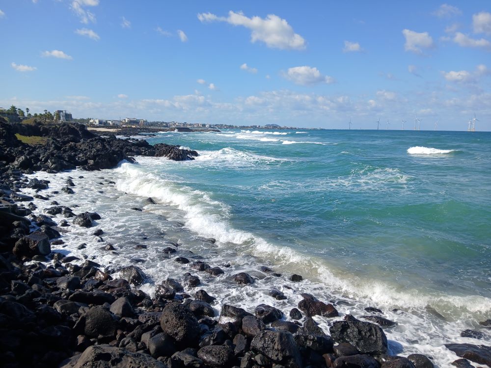 Black volcanic rock and ocean on the Aewol coast near Gwakji Beach, Jeju