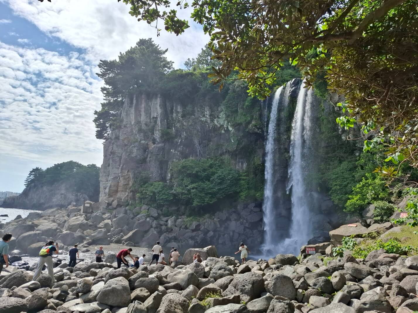 Jeongbang Waterfall flowing directly into the ocean, Jeju Island